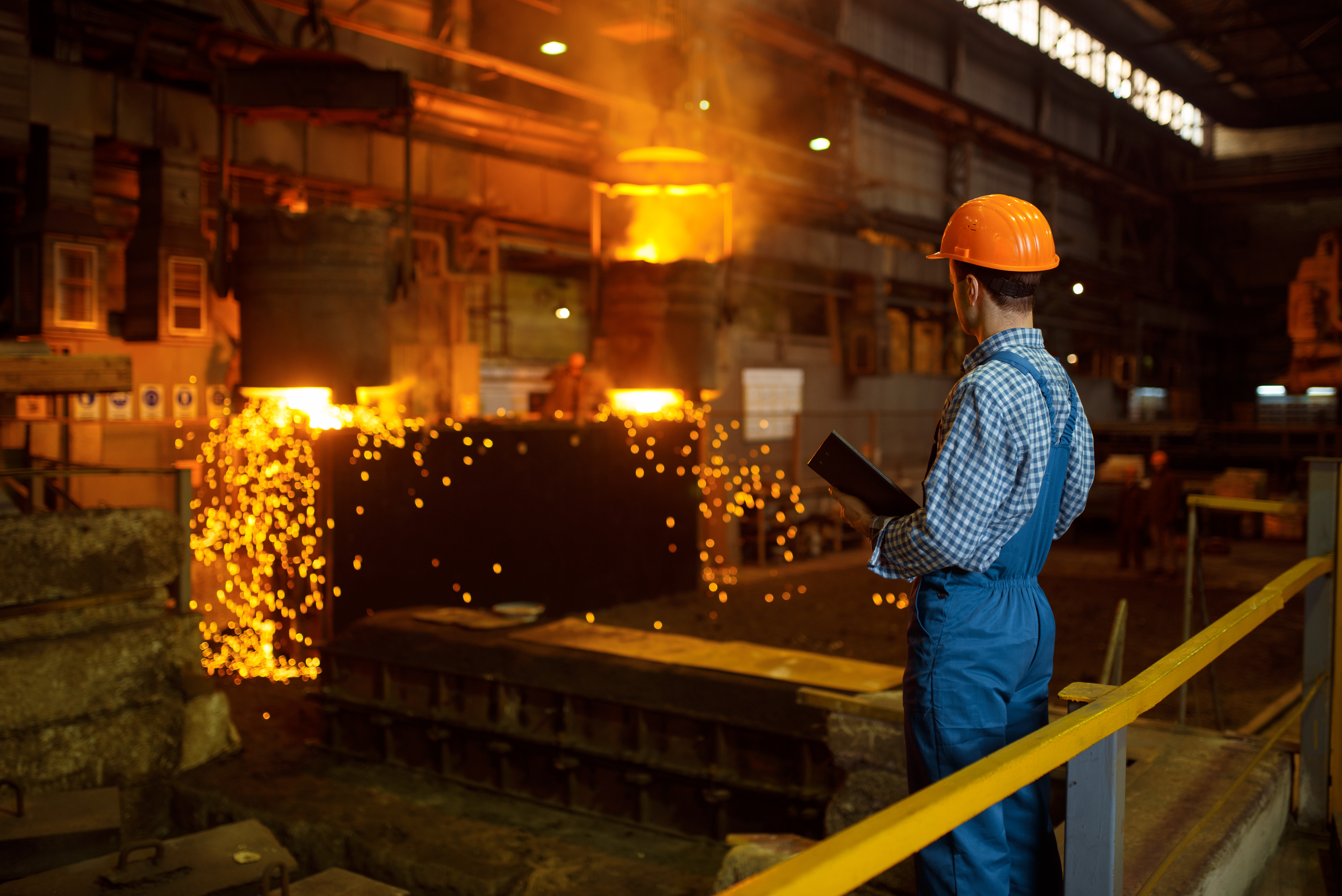 Man overlooking the production of steel
